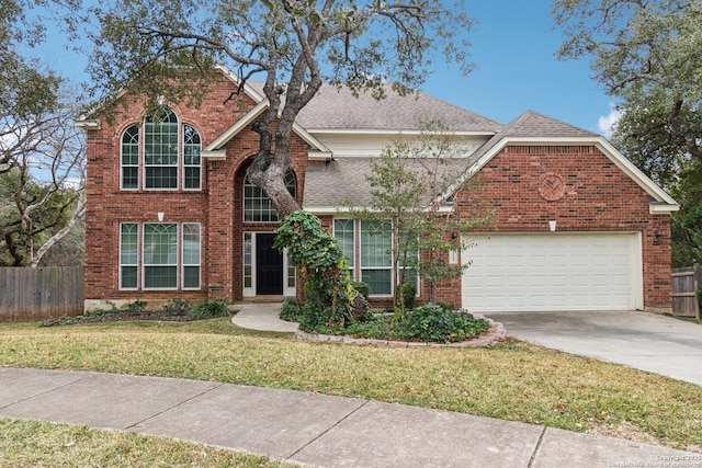 front of property featuring a front yard and a garage