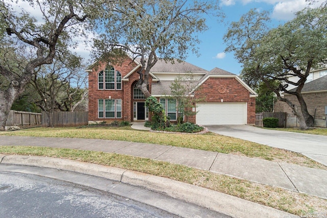 front of property featuring a front yard and a garage