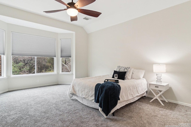 bedroom featuring carpet, vaulted ceiling, and ceiling fan