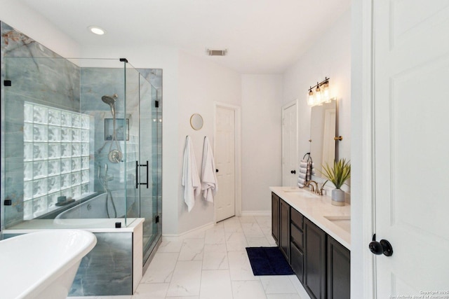 bathroom with vanity and separate shower and tub