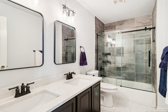 full bathroom with vanity, toilet, and bath / shower combo with glass door