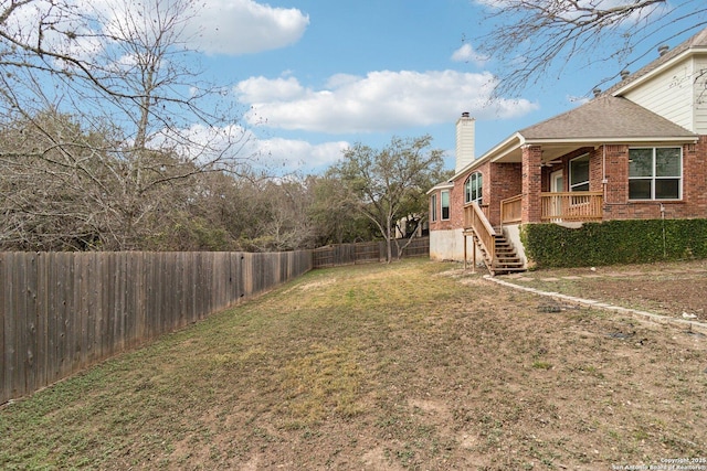 view of yard with covered porch