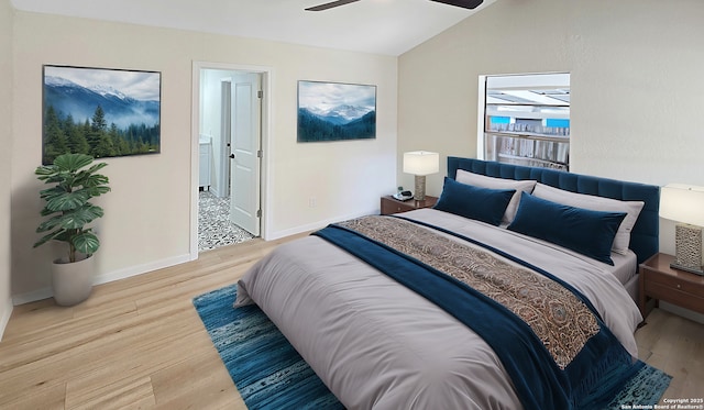 bedroom with ceiling fan, light hardwood / wood-style flooring, and lofted ceiling