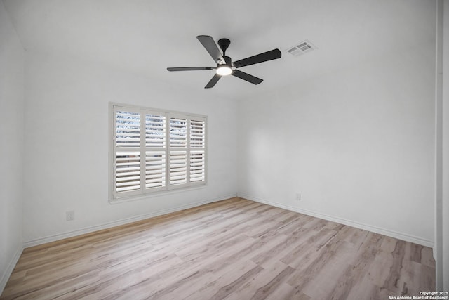 empty room with ceiling fan and light wood-type flooring