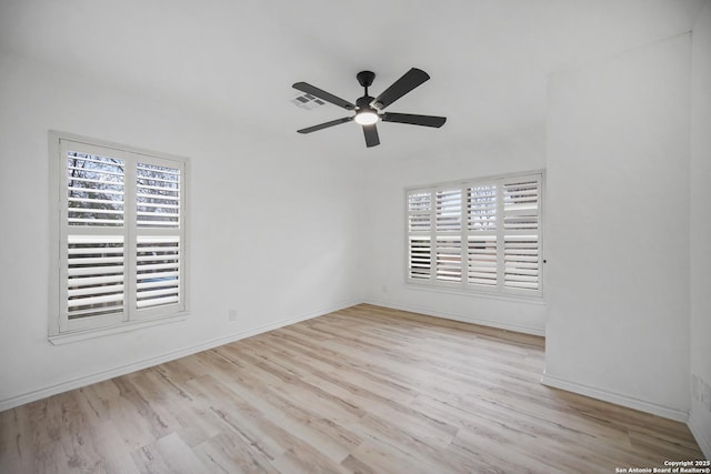 empty room with light hardwood / wood-style floors and ceiling fan