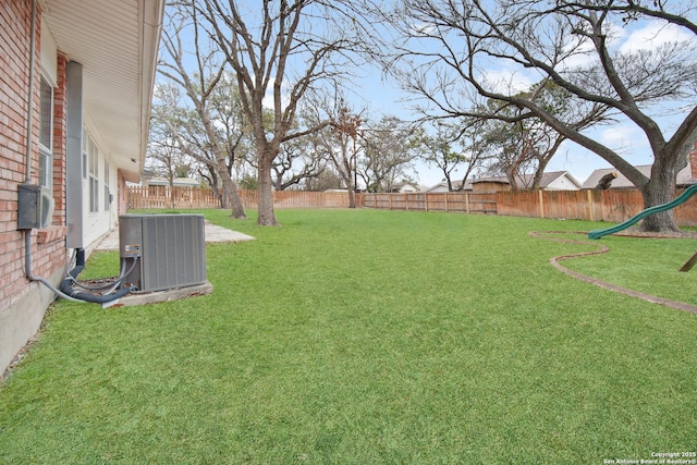 view of yard featuring central air condition unit