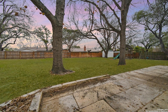 yard at dusk with a playground