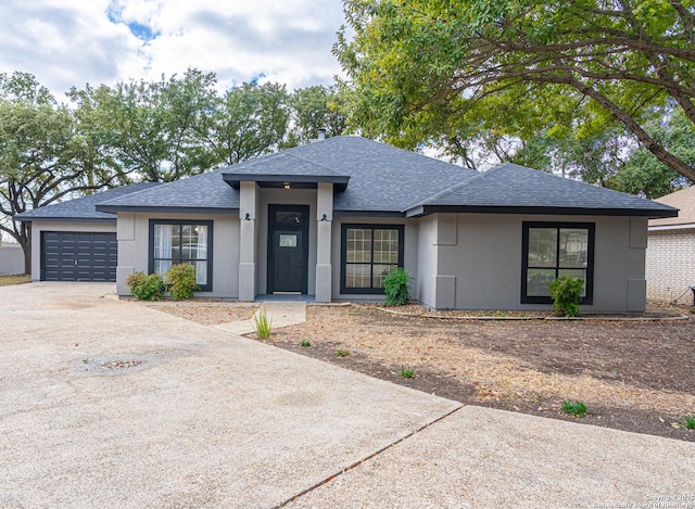 prairie-style home featuring a garage