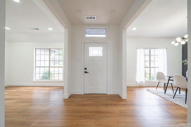 entryway with light hardwood / wood-style floors