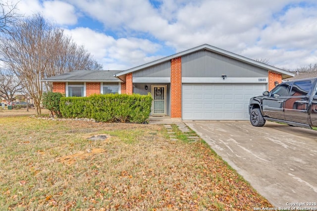 single story home with a front yard and a garage