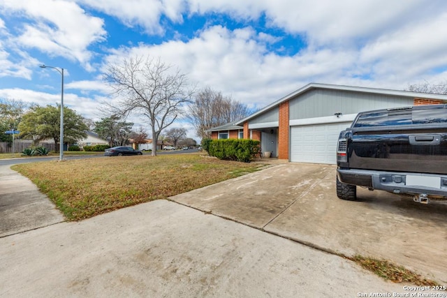 view of home's exterior with a lawn and a garage