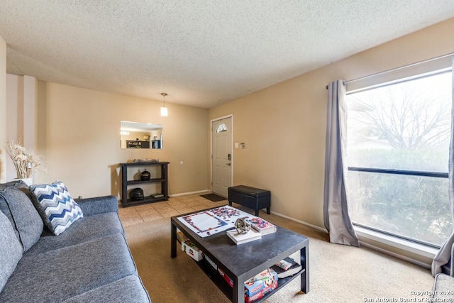 living room with a textured ceiling, light carpet, and a baseboard heating unit