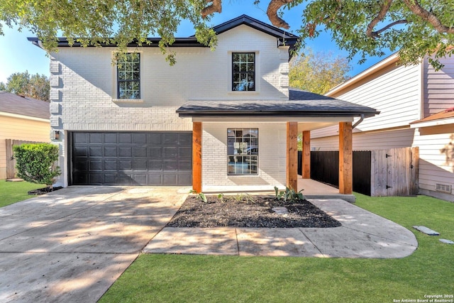 view of front of house with a garage and a front yard