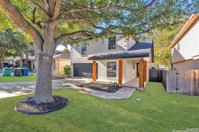 view of front of home featuring a garage and a front yard