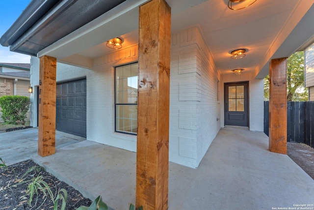 view of exterior entry with a garage