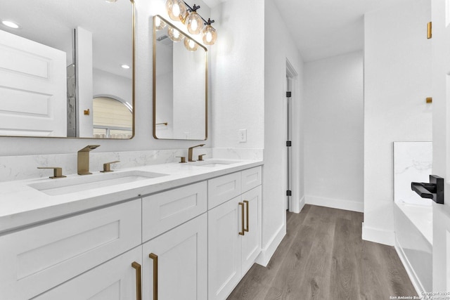 bathroom featuring hardwood / wood-style flooring and vanity