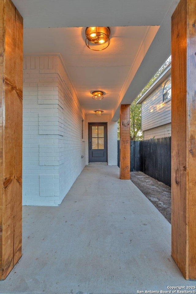 entrance to property featuring a patio area