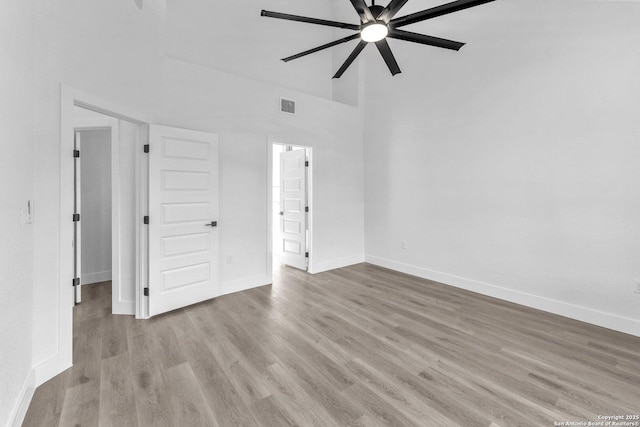 empty room featuring ceiling fan and light wood-type flooring