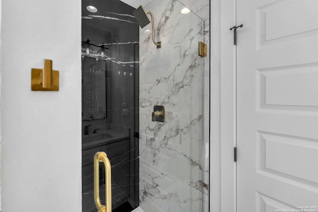 bathroom with a shower with shower door