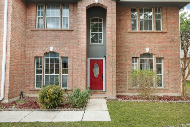 view of front of home featuring brick siding