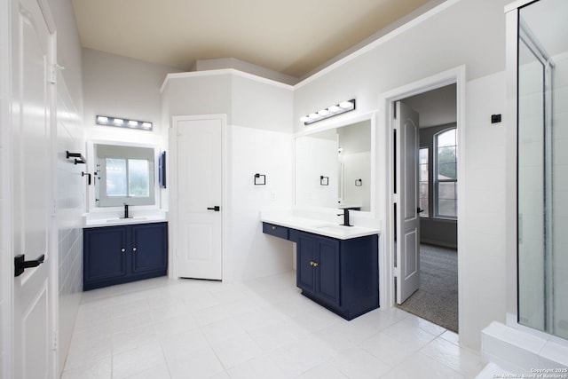 bathroom featuring tile patterned flooring and vanity