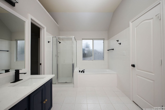 bathroom with vanity, tile patterned flooring, plus walk in shower, and lofted ceiling