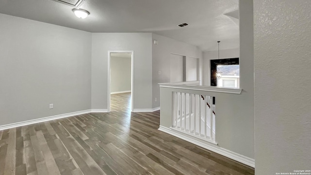 unfurnished room with hardwood / wood-style floors