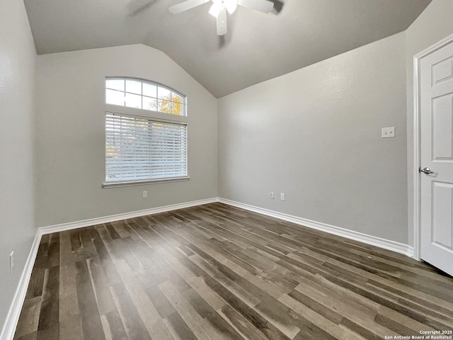 unfurnished room with ceiling fan, lofted ceiling, and dark wood-type flooring