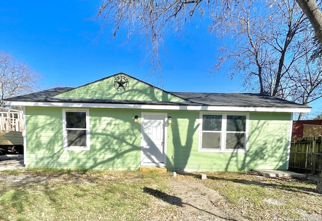 back of house featuring a yard