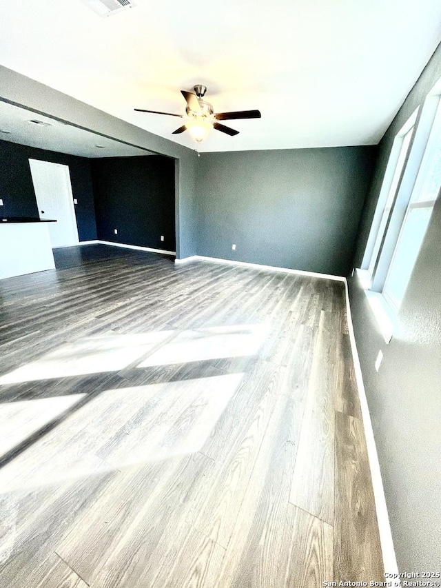 unfurnished room with hardwood / wood-style floors