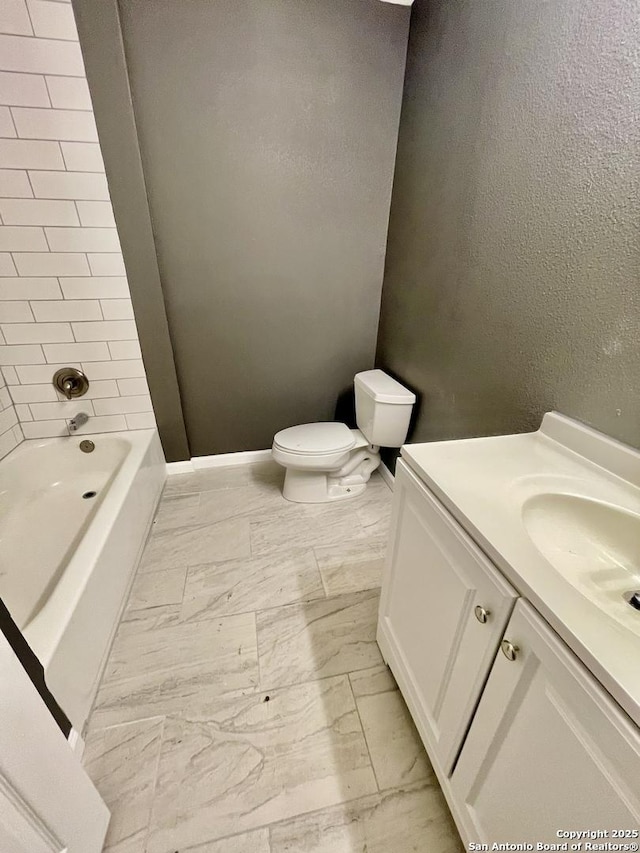 full bathroom with vanity, toilet, and tiled shower / bath combo