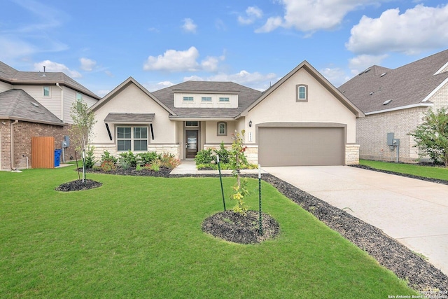 view of front of house featuring a front yard and a garage