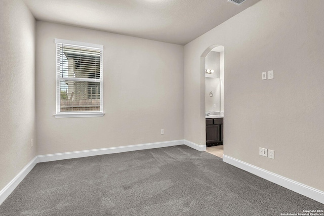 empty room with light colored carpet