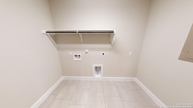 clothes washing area featuring hookup for an electric dryer, hookup for a gas dryer, electric panel, and washer hookup