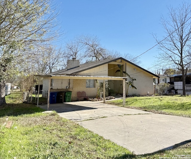 single story home featuring a front yard and a carport