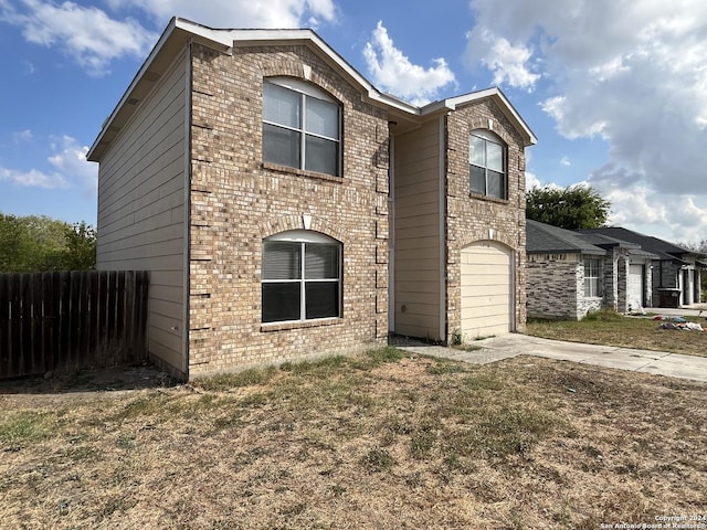 view of front of home with a garage