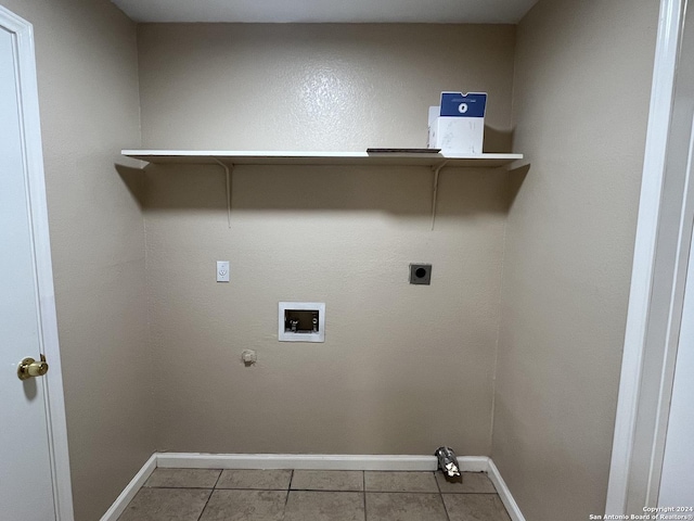 clothes washing area with hookup for a gas dryer, hookup for a washing machine, tile patterned flooring, and hookup for an electric dryer