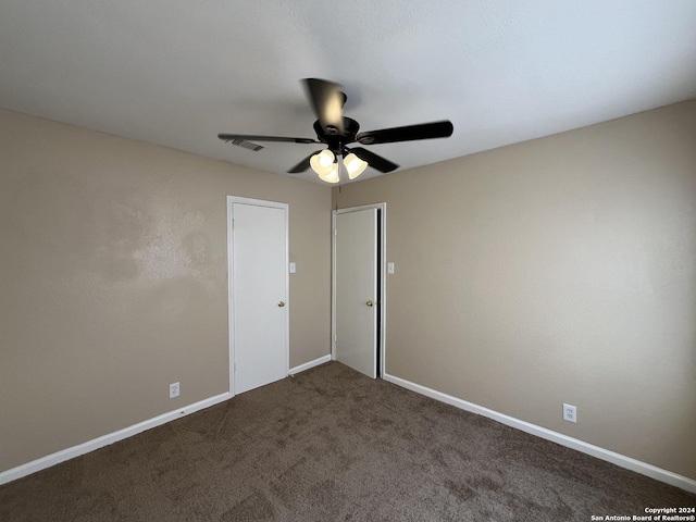 unfurnished bedroom featuring carpet flooring and ceiling fan