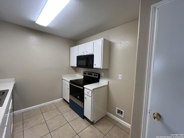 kitchen featuring white cabinets, a textured ceiling, electric range, and light tile patterned flooring