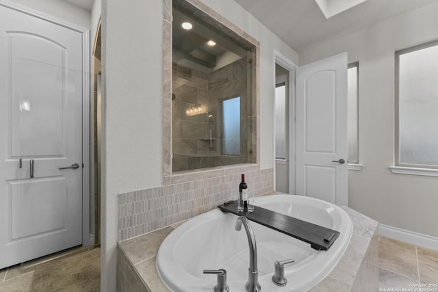 bathroom featuring tiled bath