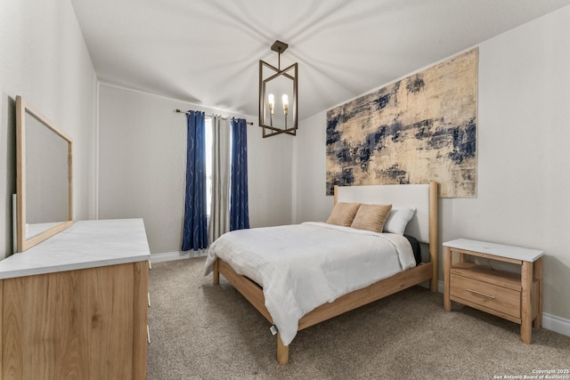 bedroom with light carpet and a notable chandelier