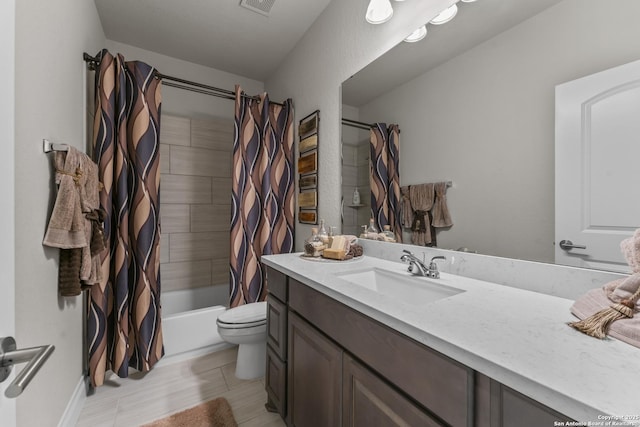 full bathroom featuring shower / bath combination with curtain, toilet, and vanity