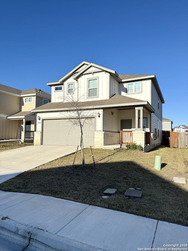 view of front of property featuring covered porch and a garage