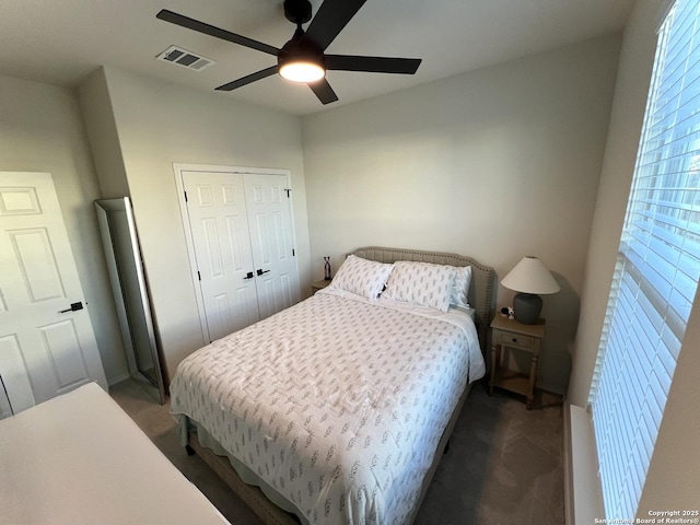 bedroom featuring ceiling fan and a closet