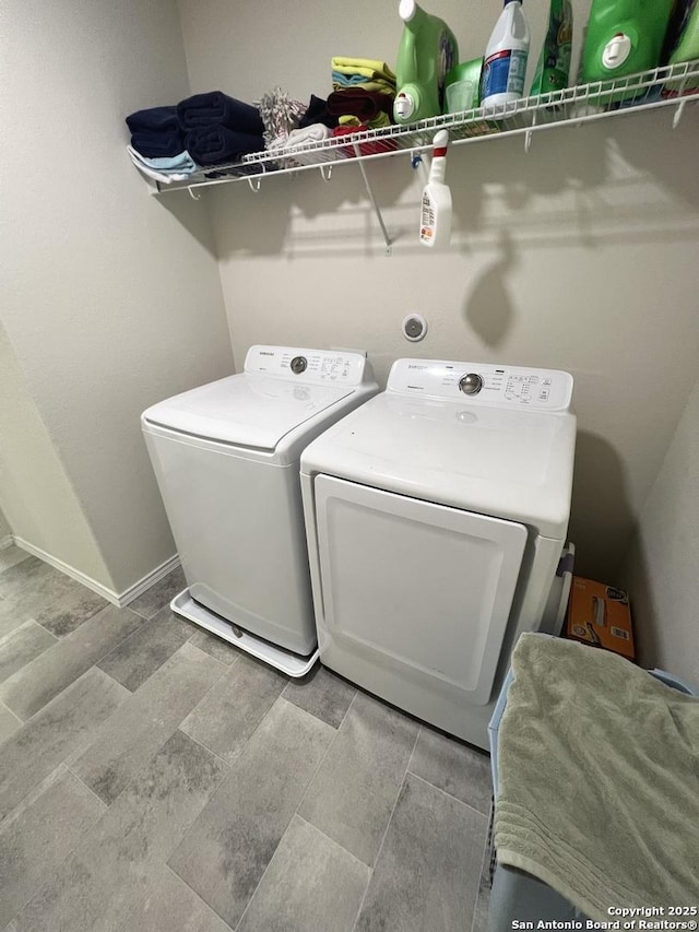 laundry room featuring separate washer and dryer