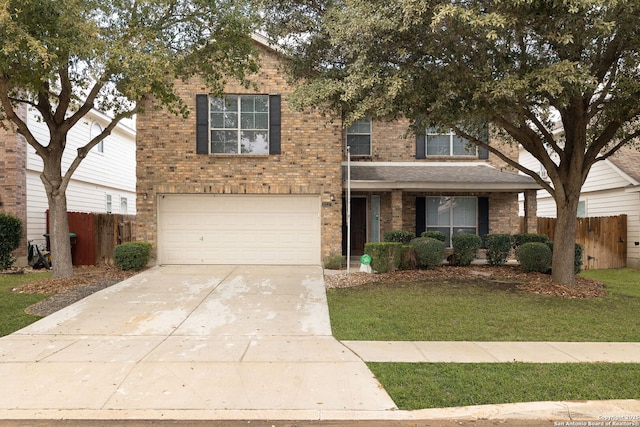 view of front of home with a garage and a front lawn