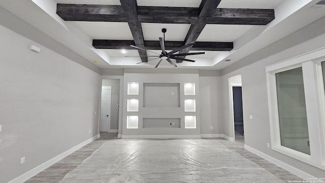 foyer with ceiling fan, beamed ceiling, and coffered ceiling