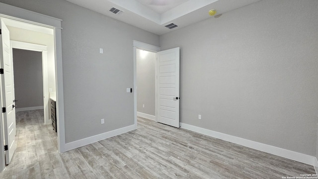 unfurnished bedroom with light wood-type flooring