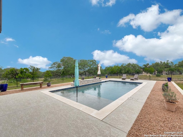 view of swimming pool featuring a patio