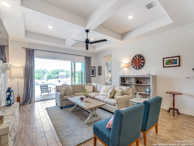 living room with beamed ceiling and ceiling fan